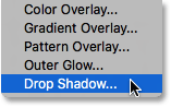 Selecting Drop Shadow from the list of layer styles. Image © 2016 Photoshop Essentials.com
