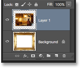 The Layers panel showing the photo added above the Background layer. Image © 2016 Photoshop Essentials.com