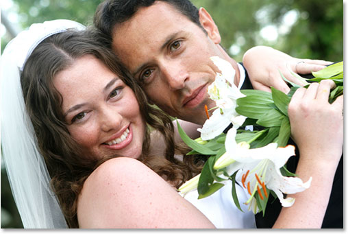 A smiling bride and groom. Image licensed from iStockphoto by Photoshop Essentials.com