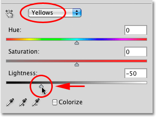 Dragging the Lightness slider in the Hue/Saturation dialog box in Photoshop. Image © 2010 Photoshop Essentials.com